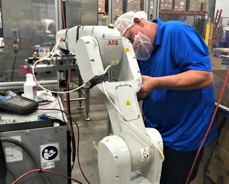 working on robotics at dairy manufacturer